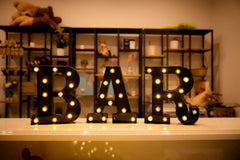 Foaky wedding marquee number sign on reception table creating focal ambiance