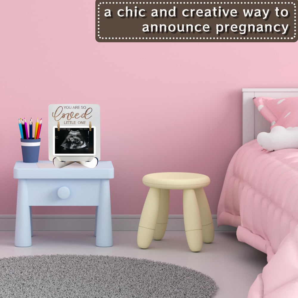 Focal20 frame pairs ultrasound photos with hand and footprints for memory pages.