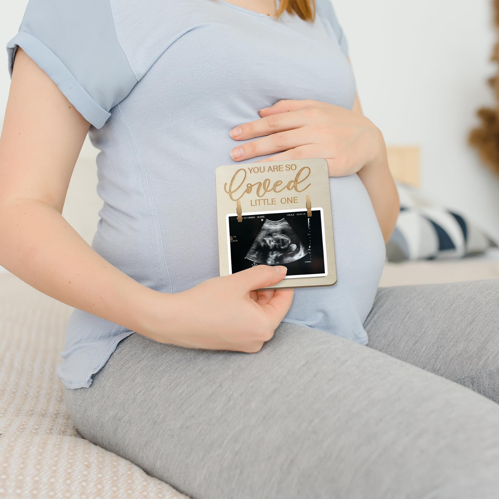Focal20 wooden ultrasound frame enhances nursery decor with a warm natural finish.