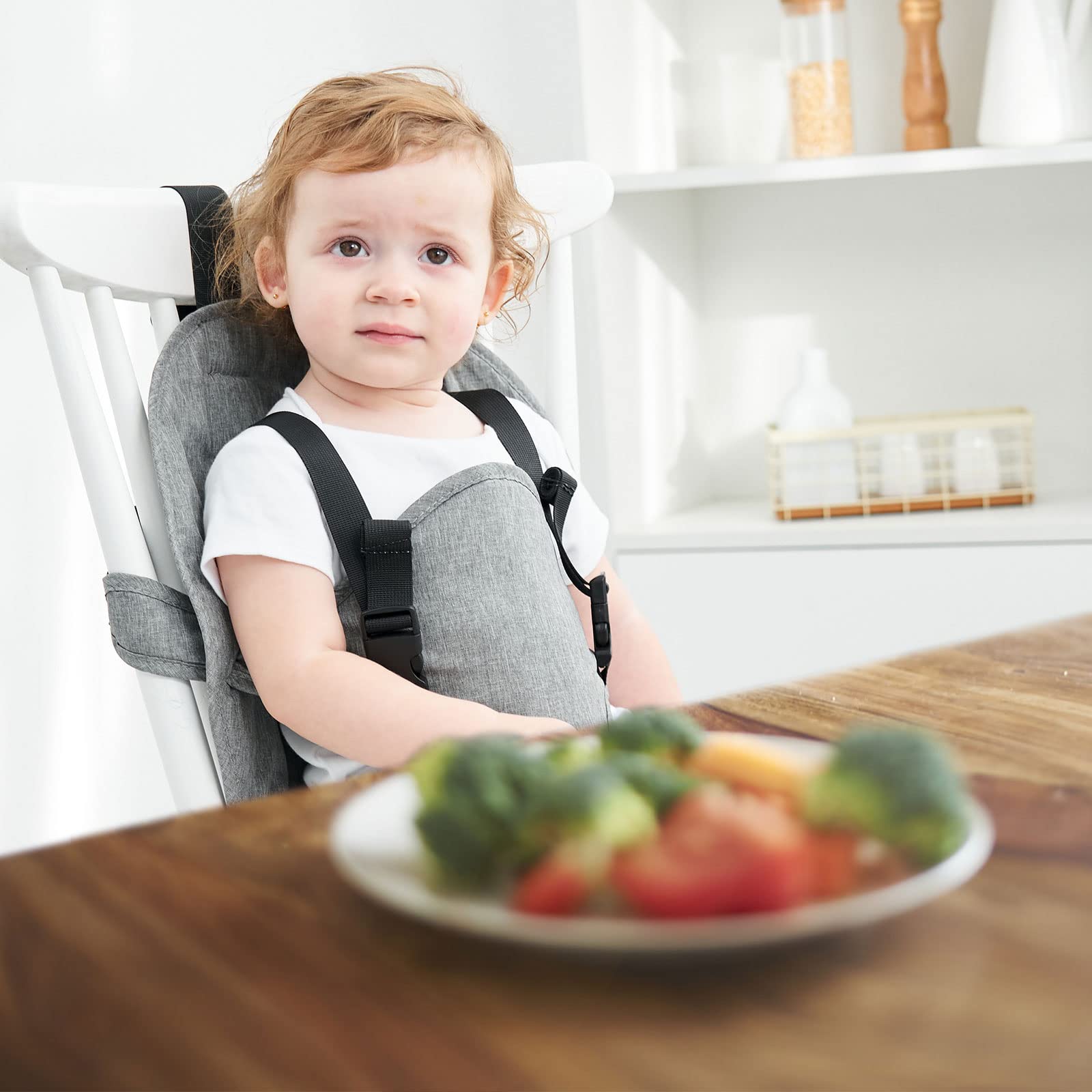 Focefec baby harness seat in use at the dining table.