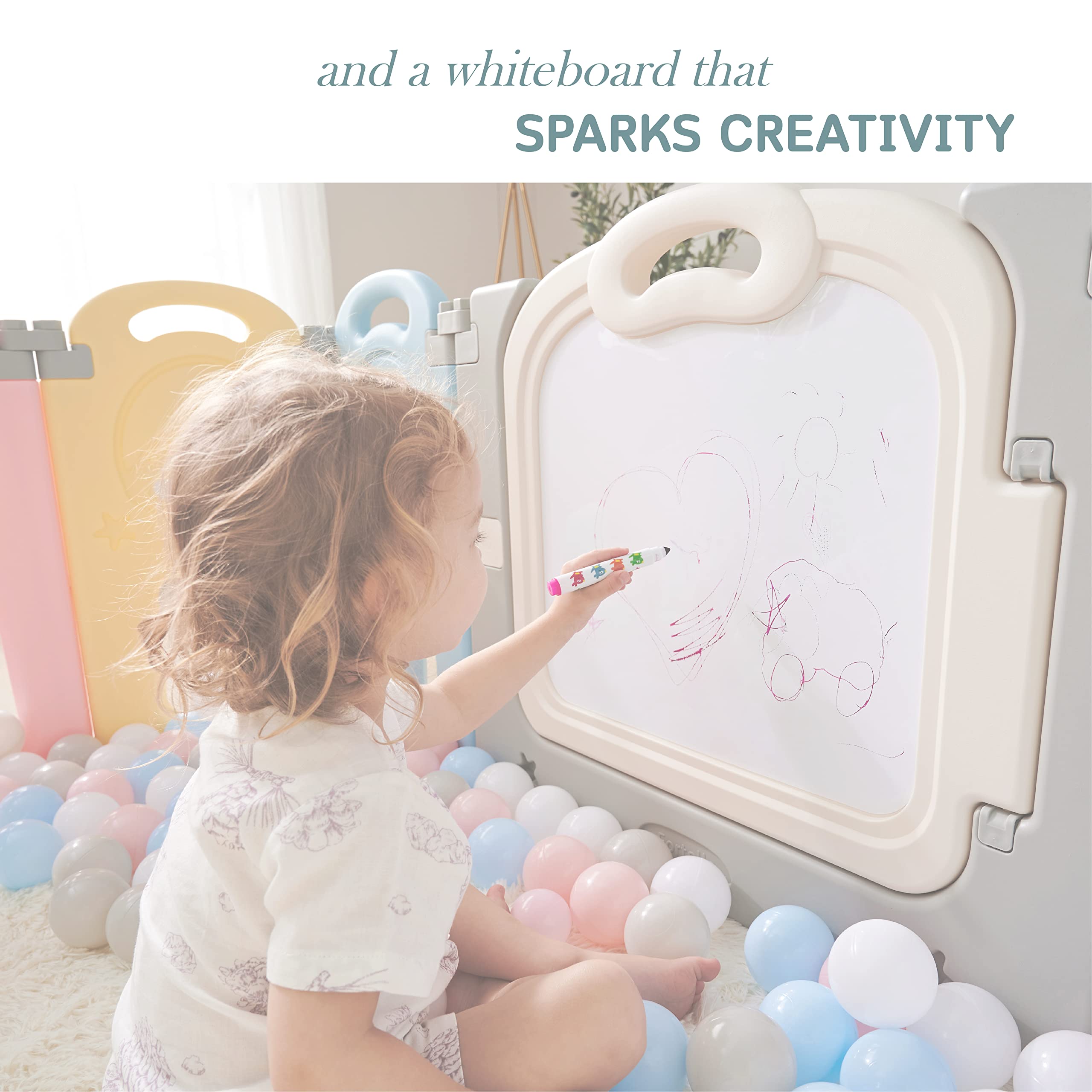 Fortella Cloud Castle Playpen whiteboard on the back panel for drawing ideas.