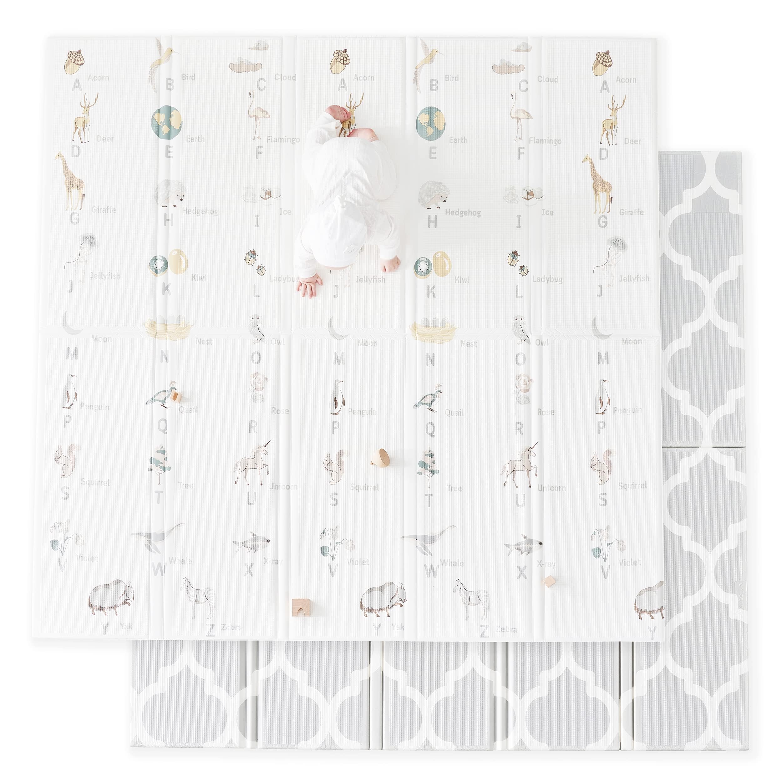 Fortella Cuddle and Learn playmat with alphabet and nature objects for early language exploration.