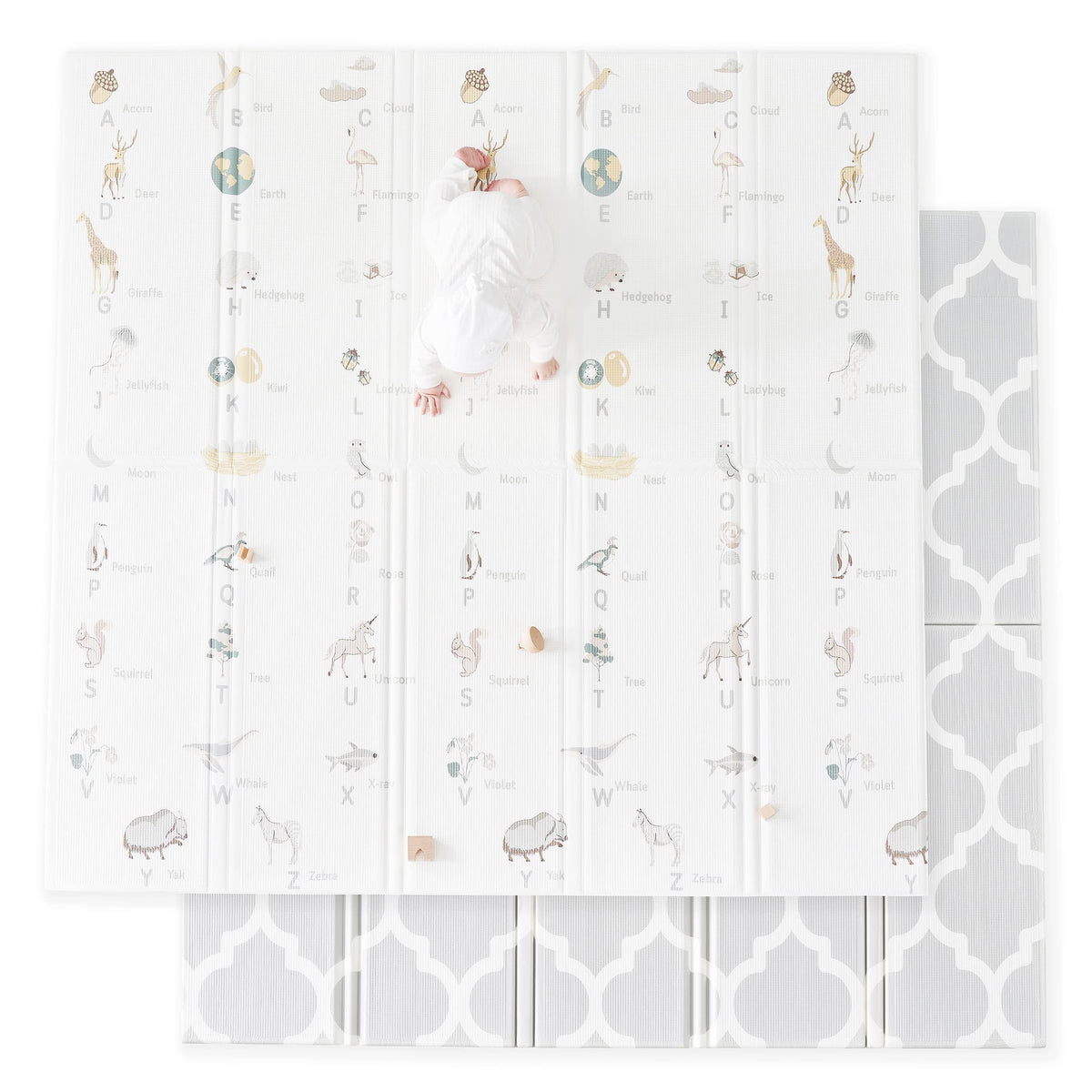 Fortella Cuddle and Learn playmat with alphabet and nature objects for early language exploration.