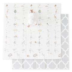 Fortella Cuddle and Learn playmat with alphabet and nature objects for early language exploration.