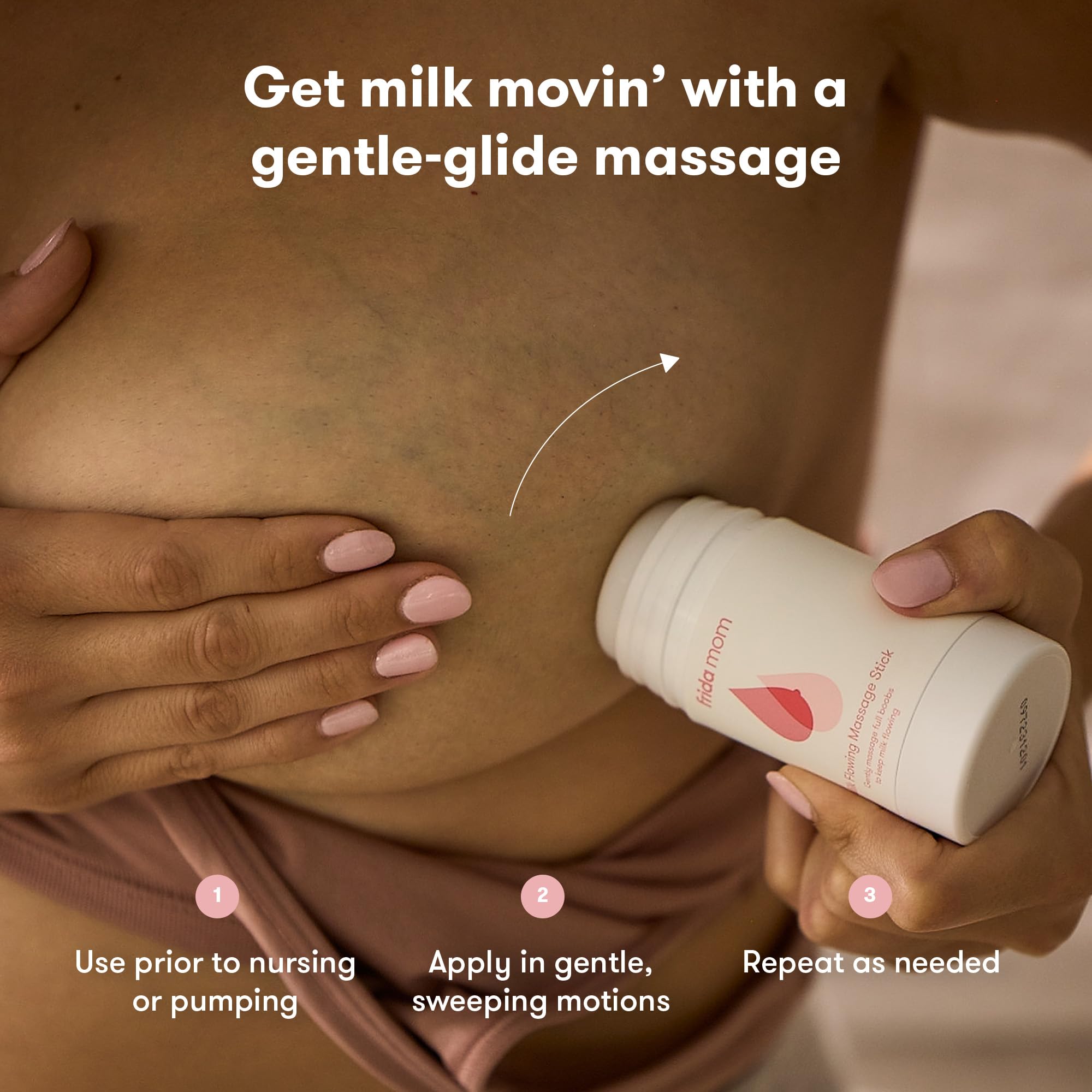Frida Mom Milk Flowing Massage Stick on the breast during a soothing massage.