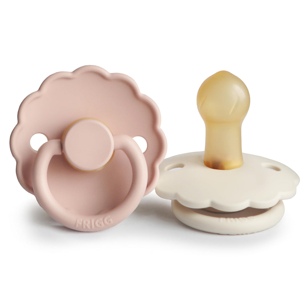 FRIGG Daisy pacifier front view highlights petal-inspired design and 0-6 month use.
