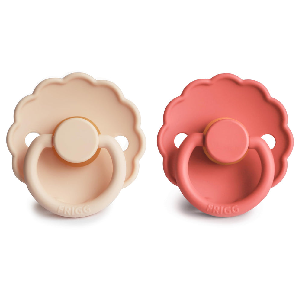 FRIGG Daisy outward-curve pacifier in pink cream supports comfortable skin contact.