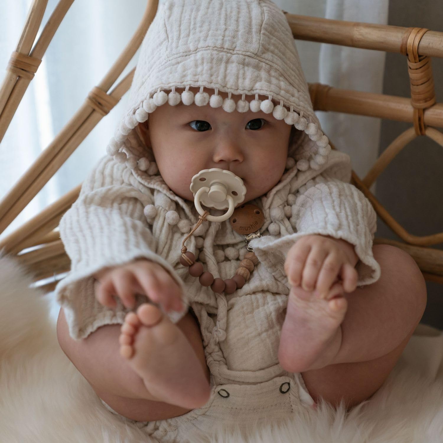 FRIGG pacifier soft-color range highlights gentle styling for baby essentials.