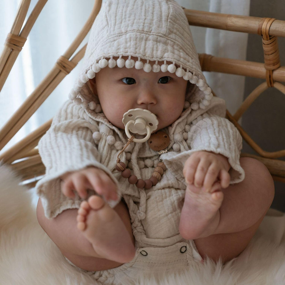 FRIGG pacifier soft-color range highlights gentle styling for baby essentials.