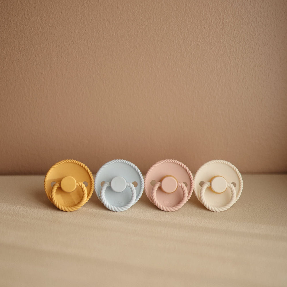 FRIGG Rope Pacifier airholes promote breathability and skin comfort.