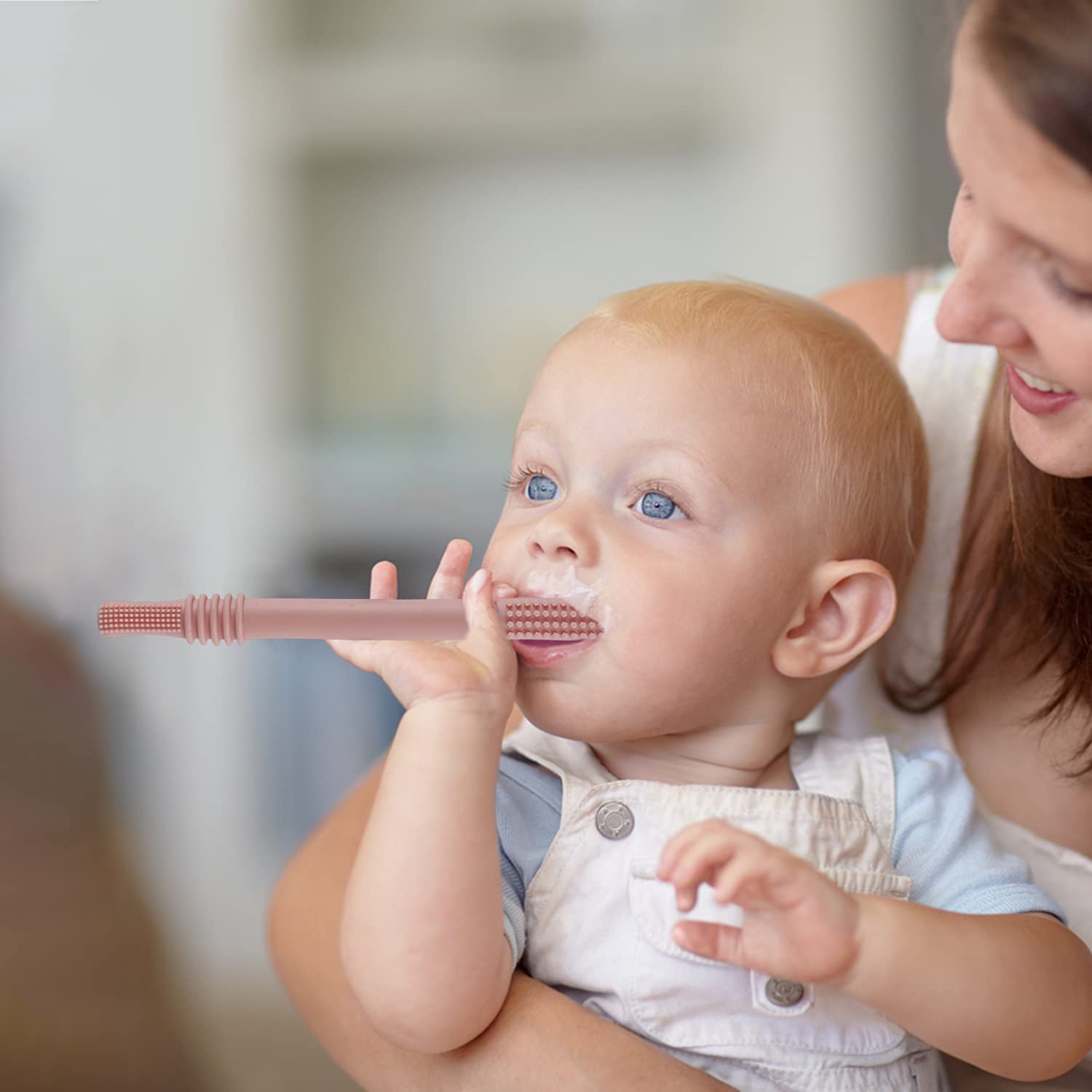 Fu Store hollow red teether tube helps soothe gums during playtime.