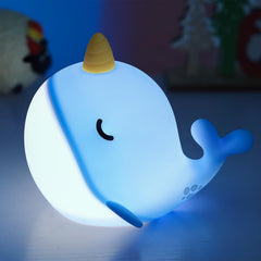 Fuloon Narwhal night light in blue whale shape provides calming bedtime illumination.
