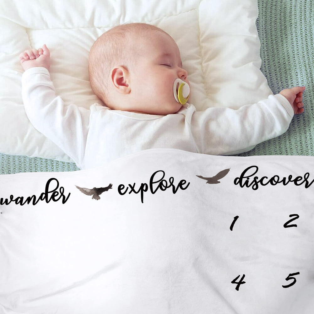 Fundich forest-inspired nursery decor complements woodland baby photos.