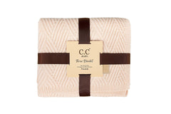 Funky Junque Tie Dye Viscose Baby Blanket laid out as a play mat in beige