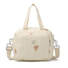 Fwkekye small diaper bag tote with multiple pockets for quick access.