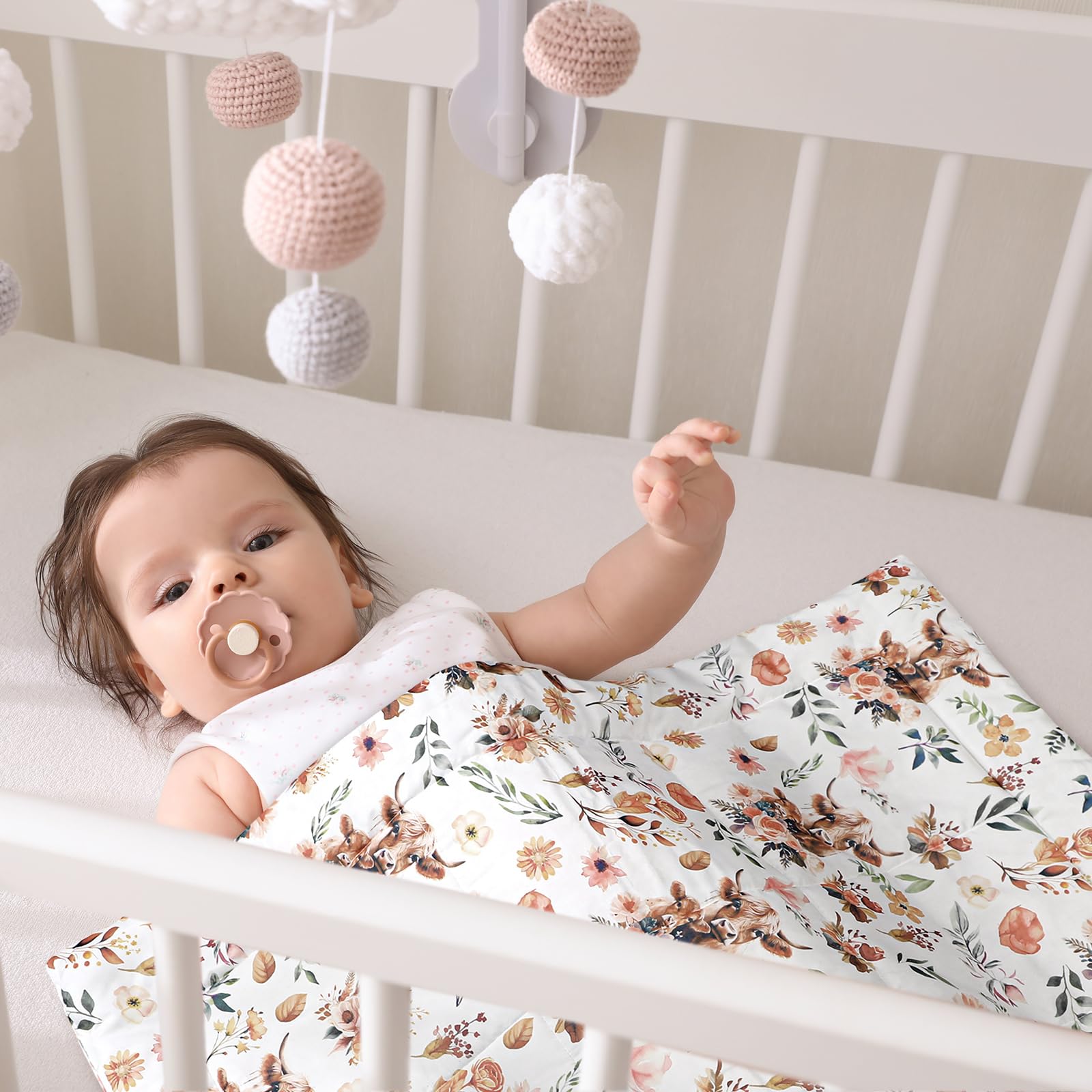 Ganeen Highland Cow pattern detail for playful baby room charm.