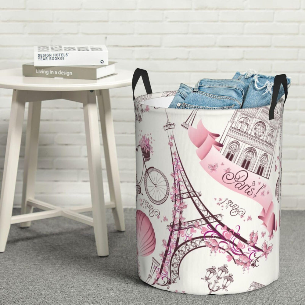 Gbuzozie Paris Eiffel Tower round laundry hamper, nursery room setup for toys and essentials.