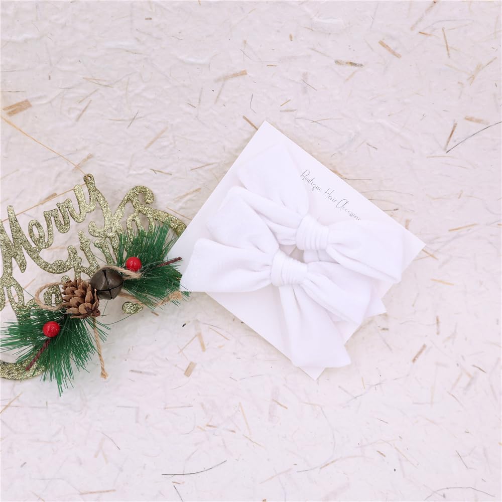 Gebelle white velvet bow on a child, versatile for holidays and birthdays