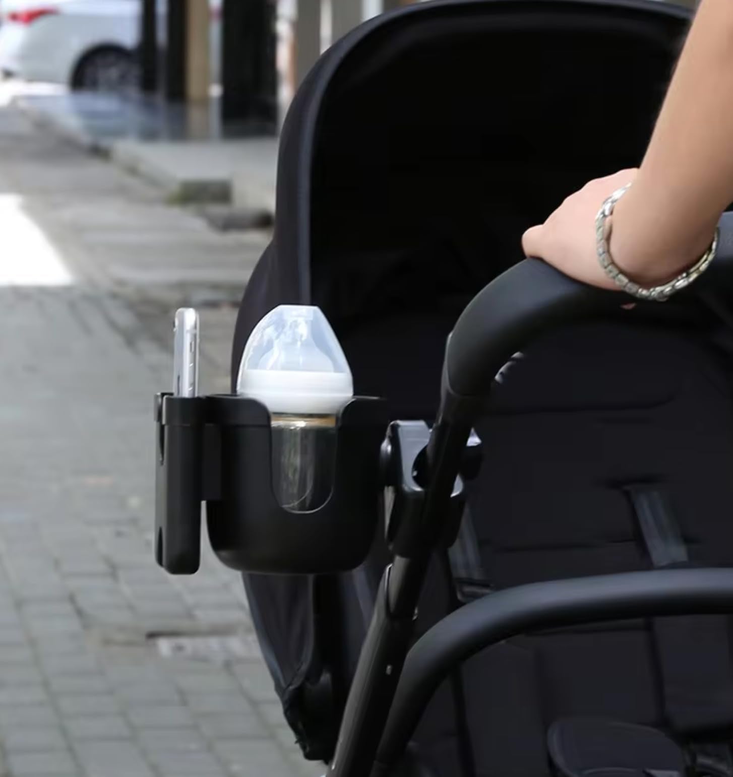 Generic cup holder attachment for bikes and strollers secures cups during rides.