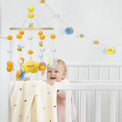 Generic nursery decor mobile in yellow and green brightens the nursery