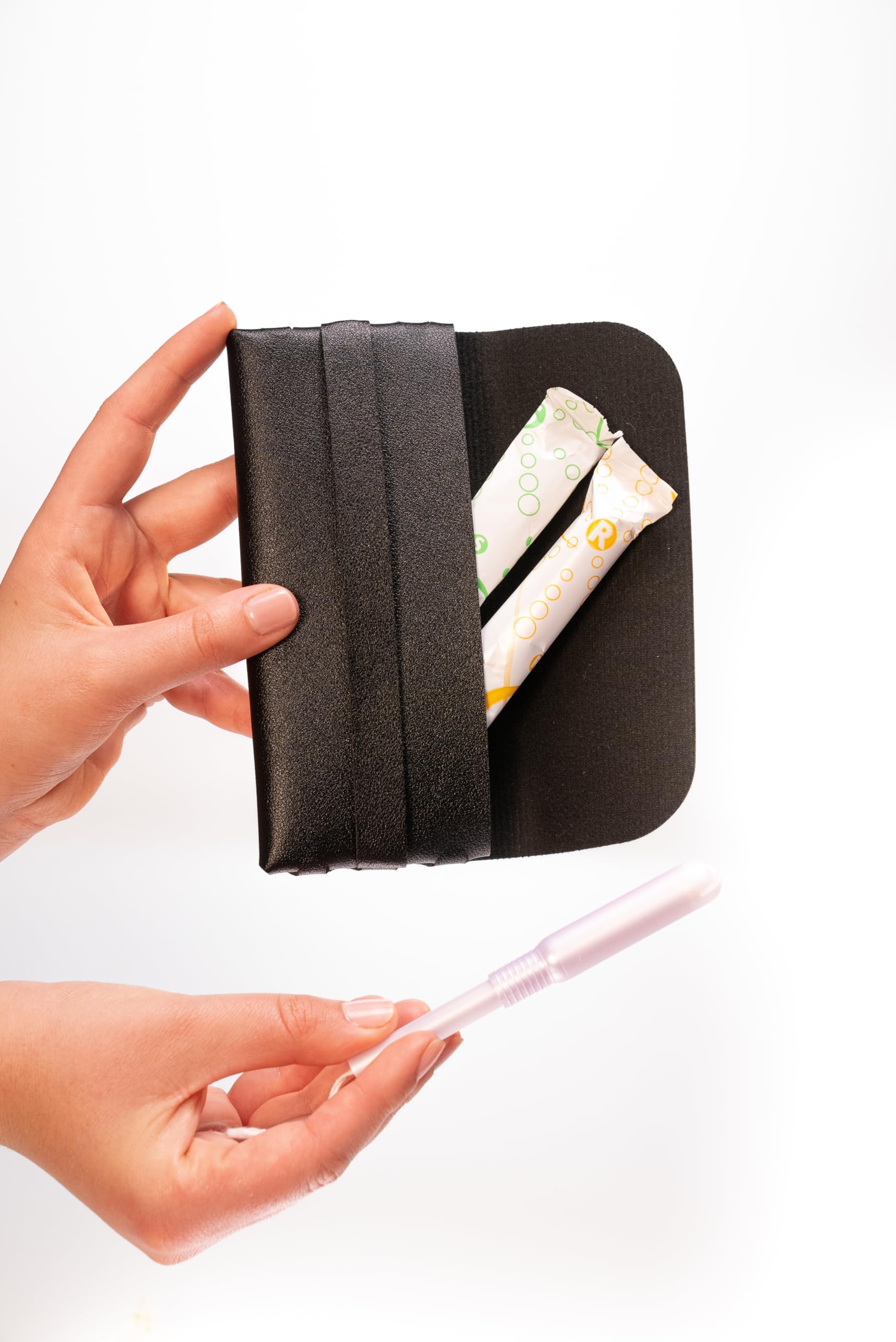 Generic TAMPONCASE compact design in black for easy purse storage.
