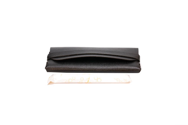 Generic TAMPONCASE travel tampon case in black keeps tampons secure.