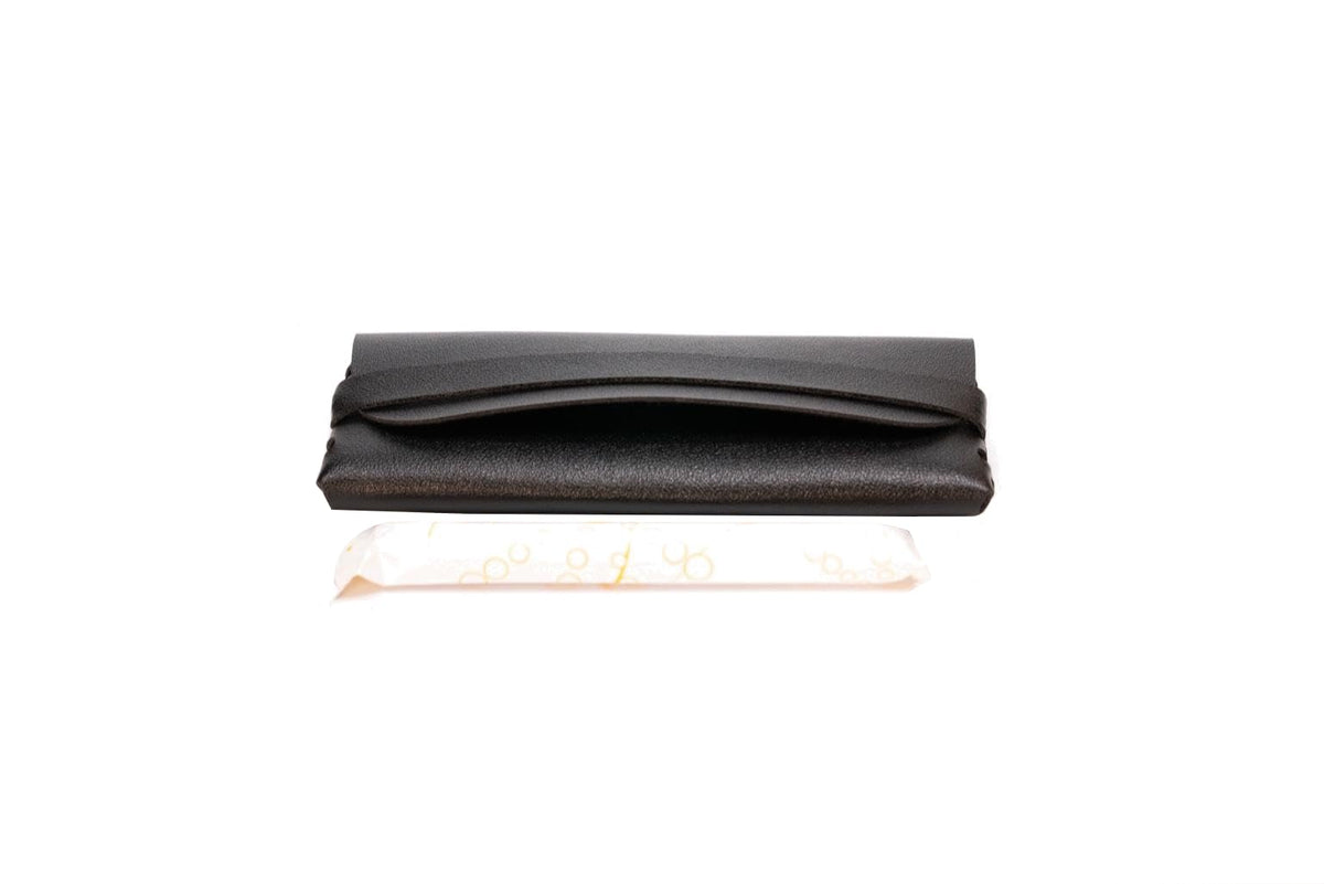 Generic TAMPONCASE travel tampon case in black keeps tampons secure.