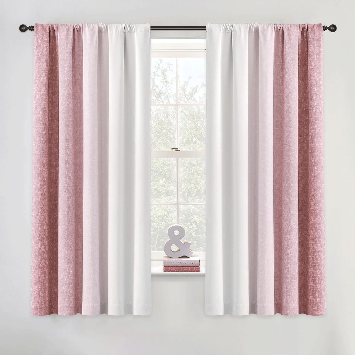 Geomoroccan ombre curtains in pink to white gradient for bedroom ambiance.