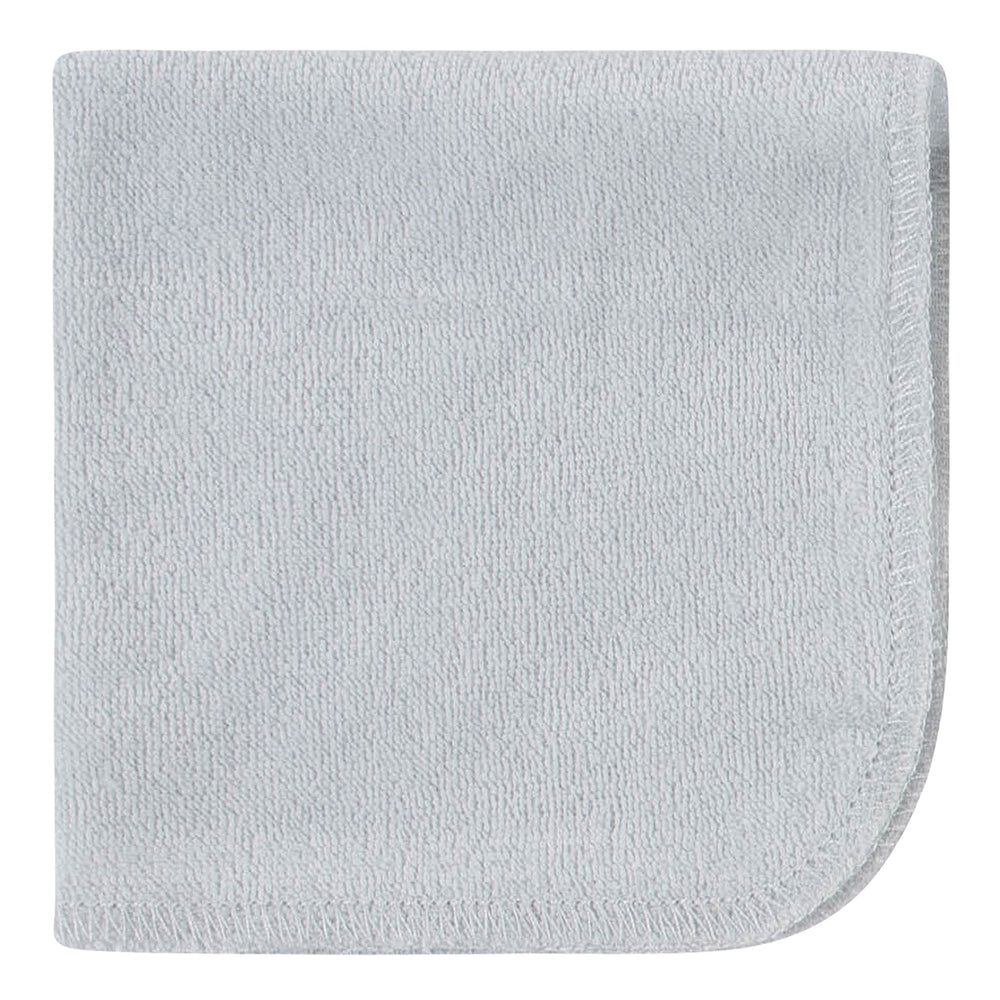 Folded bear-green Gerber washcloths ready for bath time prep.