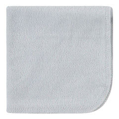 Folded bear-green Gerber washcloths ready for bath time prep.