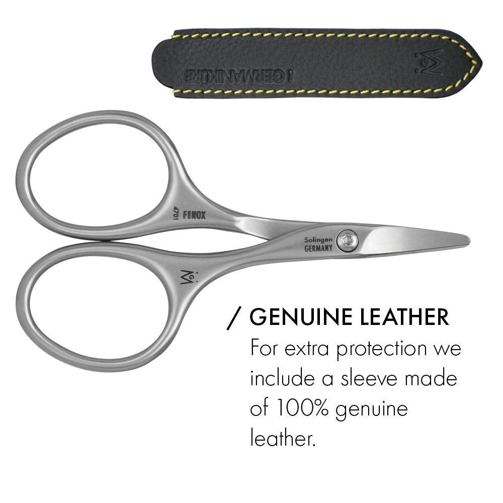 In-use view of GERManikure scissors trimming a nail