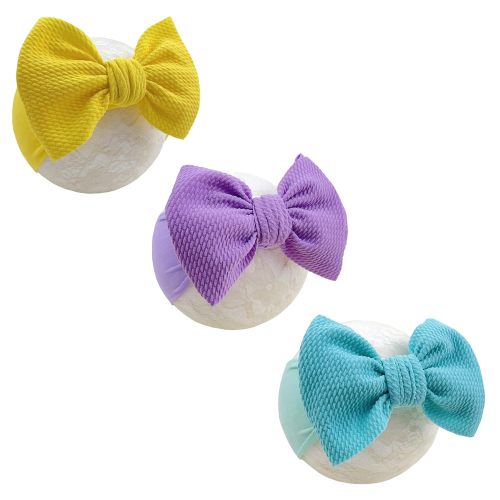 GEZISAN baby headband with nylon bow on newborn for gentle comfort.