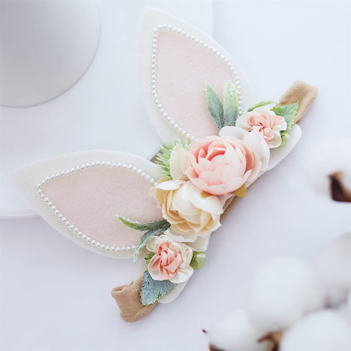 GEZISAN newborn-to-toddler headband, stretchy and growth-friendly.