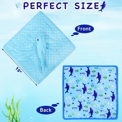 Baby holding the shark blanket lovey for secure, portable comfort.