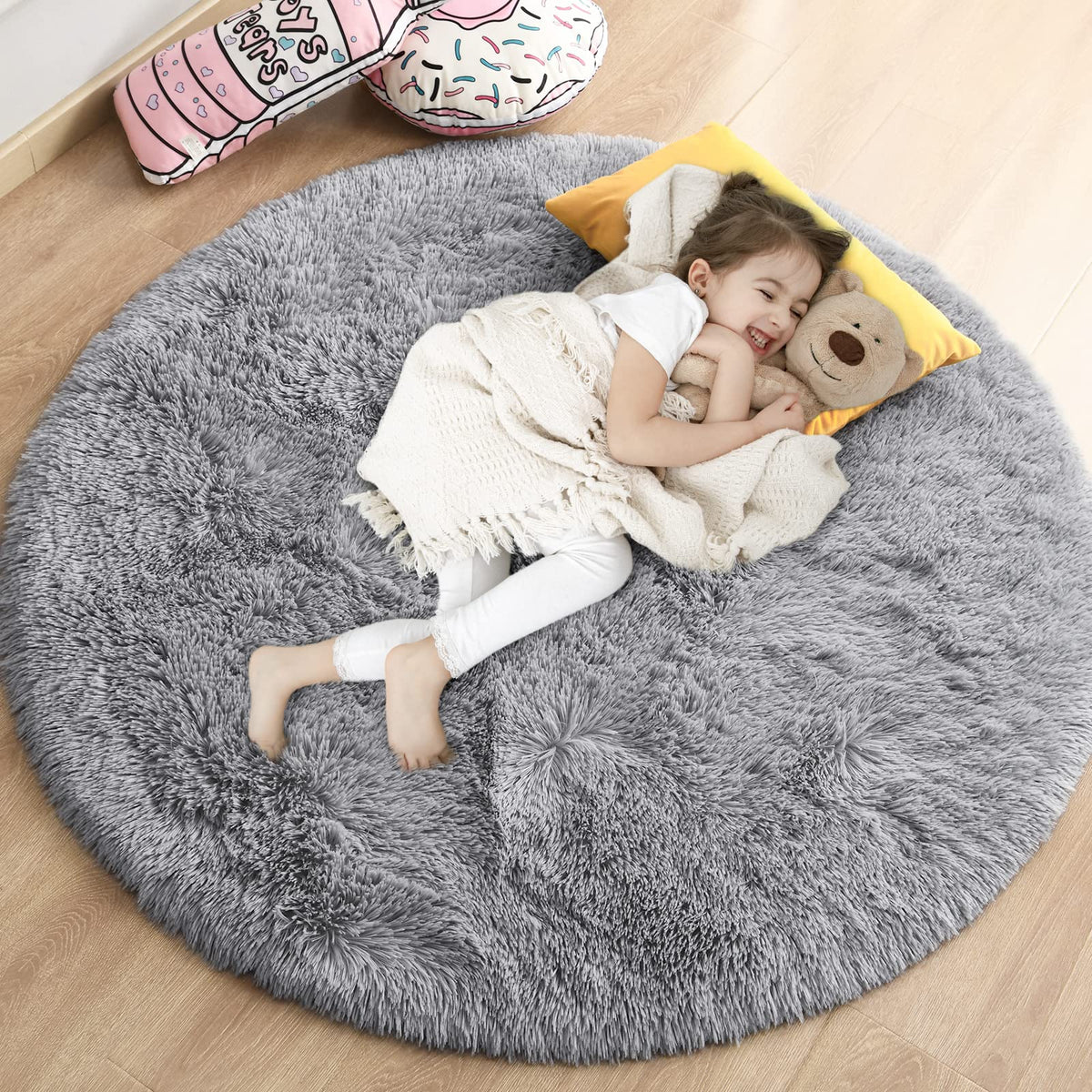 Gifeas grey fluffy circle rug in 4x4 ft, plush texture for cozy bedside areas.