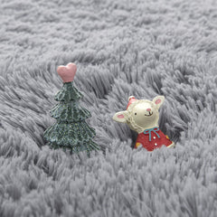 Gifeas grey fluffy circle rug in a kid's room adding warmth and charm.
