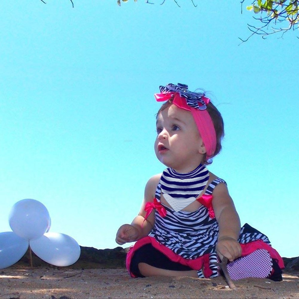 Giftty teething bib worn by baby during snack time for drool control.
