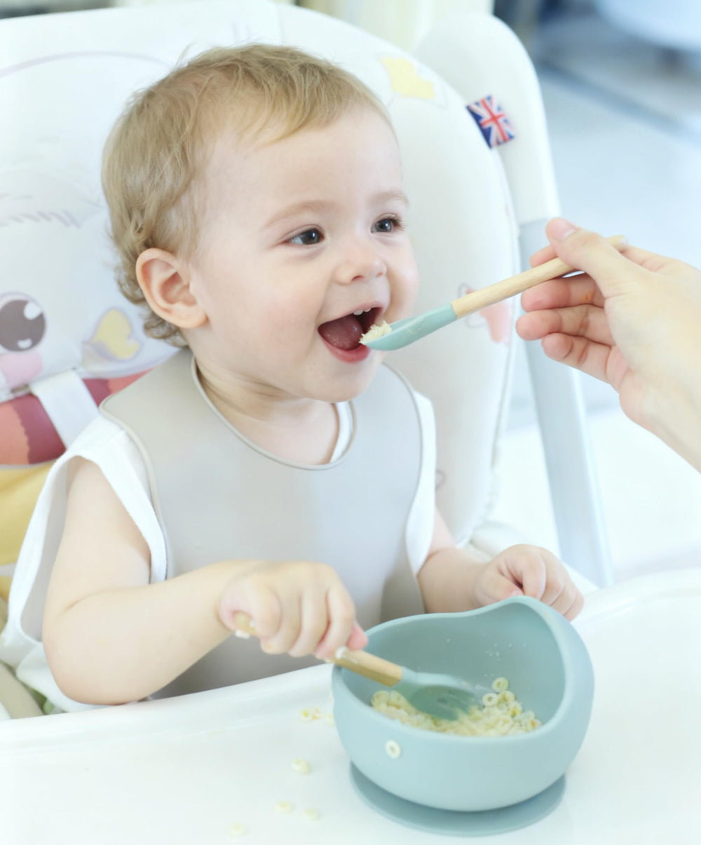 Ginbear baby feeding spoon with beech handle for gentle self-feeding.