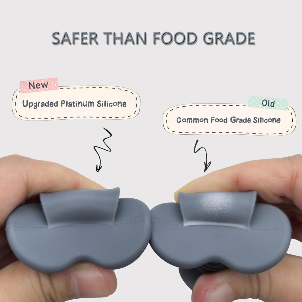 Ginbear platinum silicone baby spoon in pink with comfortable grip.