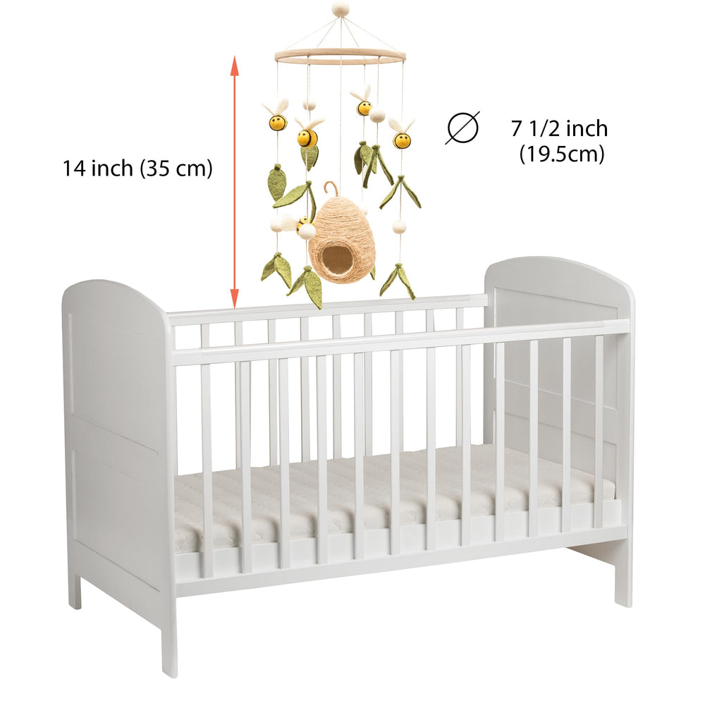 Glaciart One woodland nursery decor setup over crib with gender-neutral styling