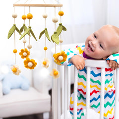 Glaciart One daisy wool mobile adds soft, calming nursery decor.