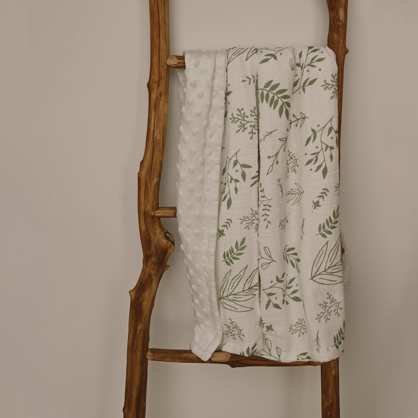 GLLQUEN BABY blanket can be used for swaddling and layering greenery