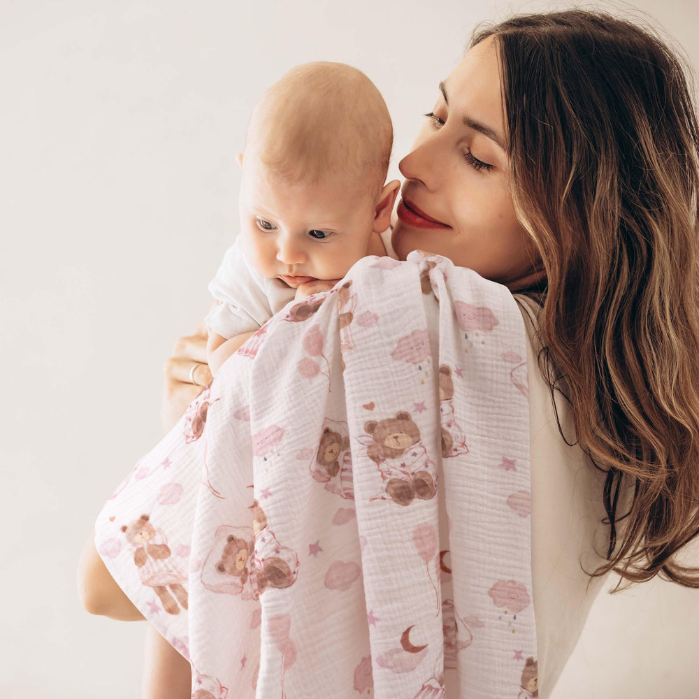 GLLQUEN BABY swaddle blanket wrapped around a baby for secure sleep