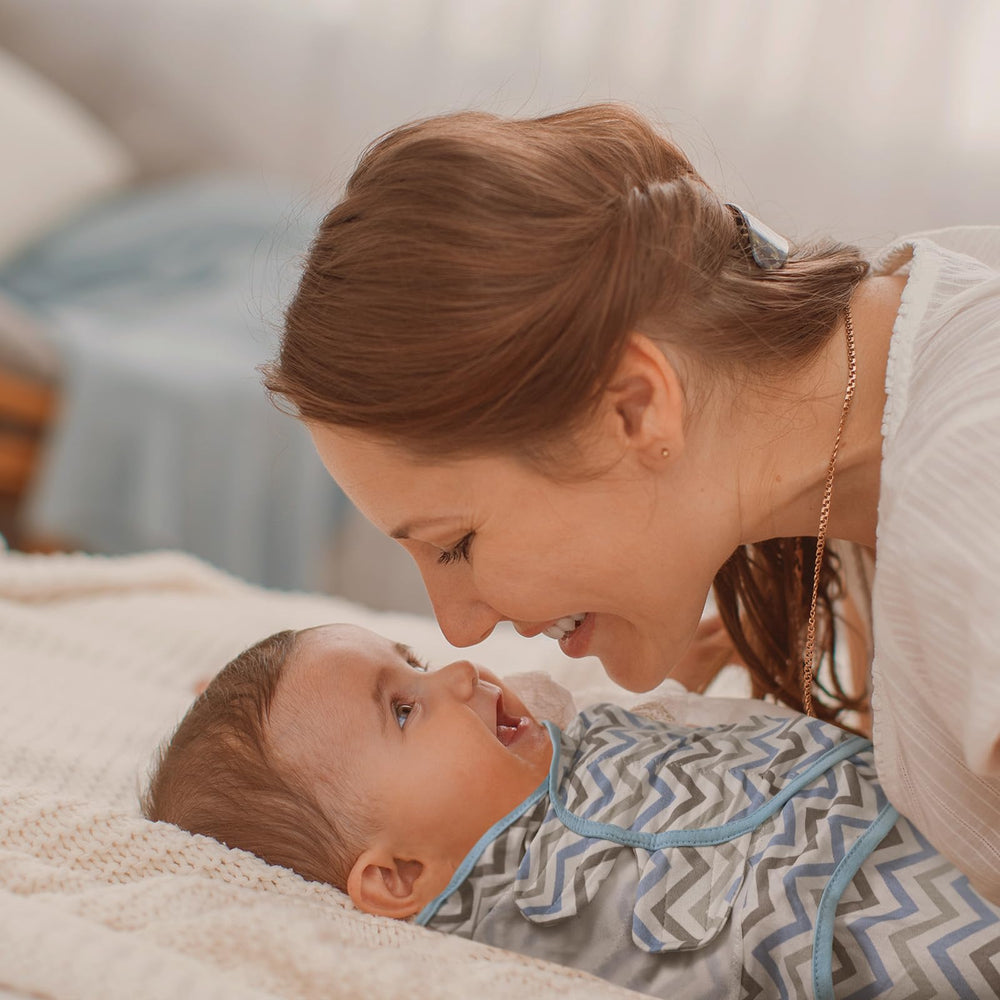 GLLQUEN BABY swaddle sack adjustable wings close-up, snug wrap as baby grows.