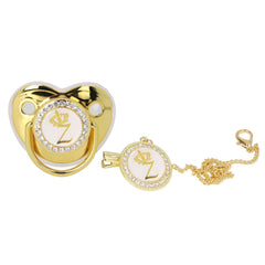 Gloglow golden-letter pacifier with bling design for stylish newborn photos.