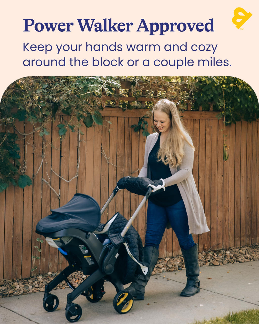 GoldBug stroller muff attachment buckle demonstrates secure mounting on most strollers.