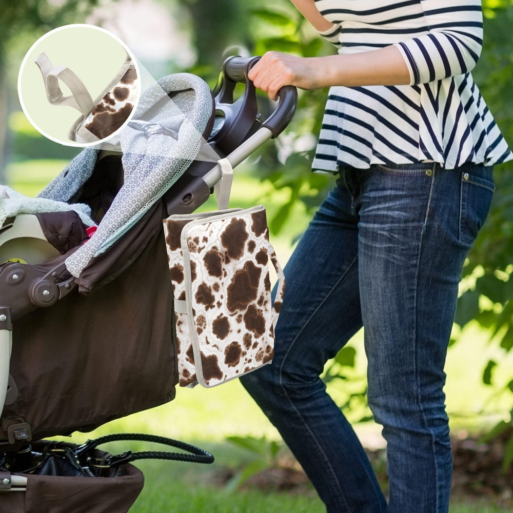 GOODOLD elastic tissue pocket keeps wipes handy during diaper changes.
