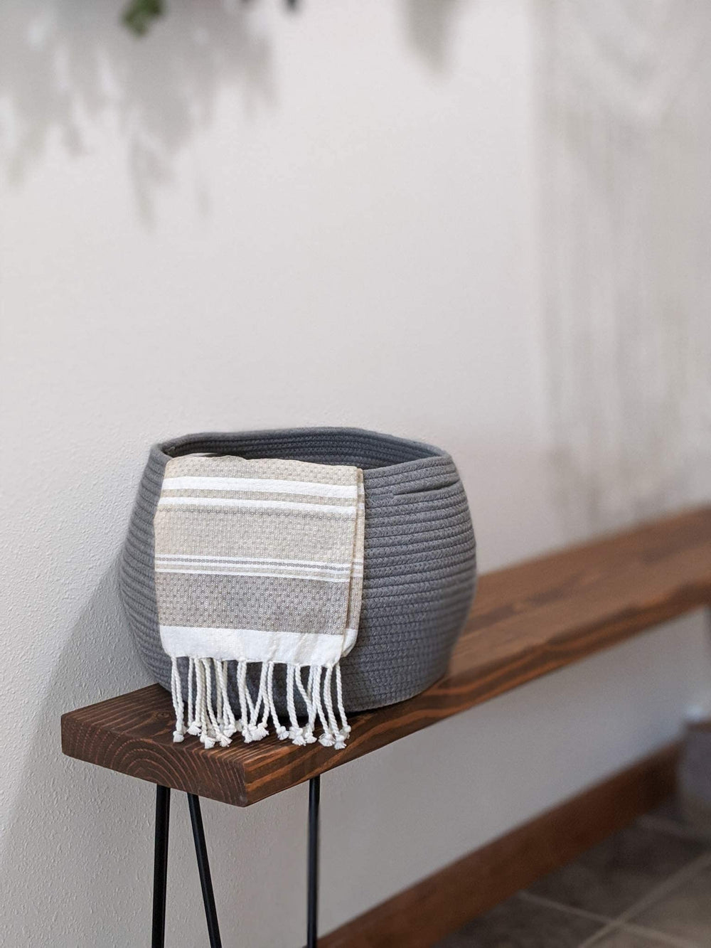 Goodpick round basket doubles as plant holder in modern decor.