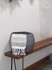 Goodpick round basket doubles as plant holder in modern decor.