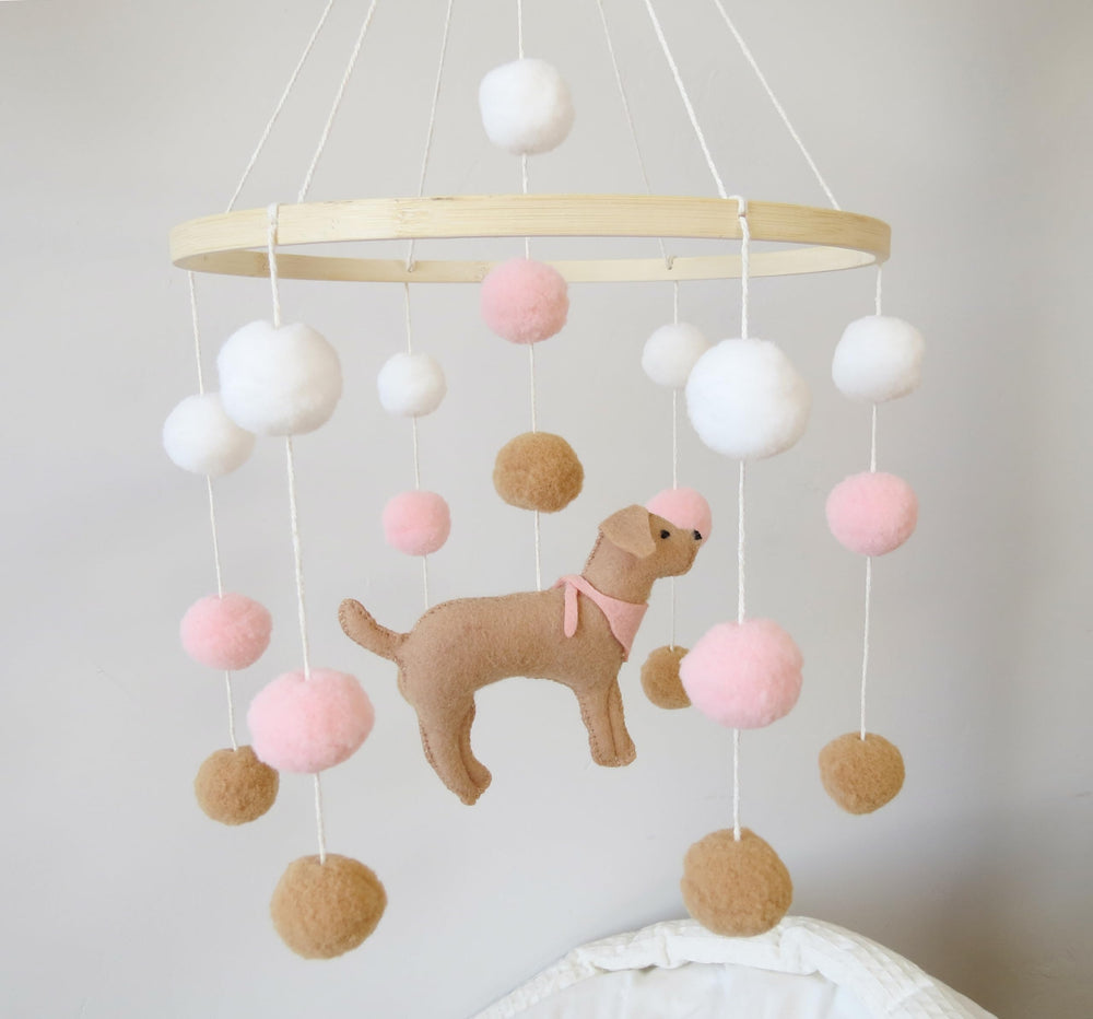 Goukurlsma crib mobile decor featuring dogs adds whimsy.
